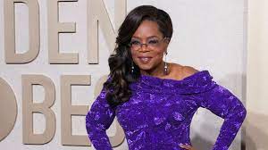 Oprah Winfrey with purple dress